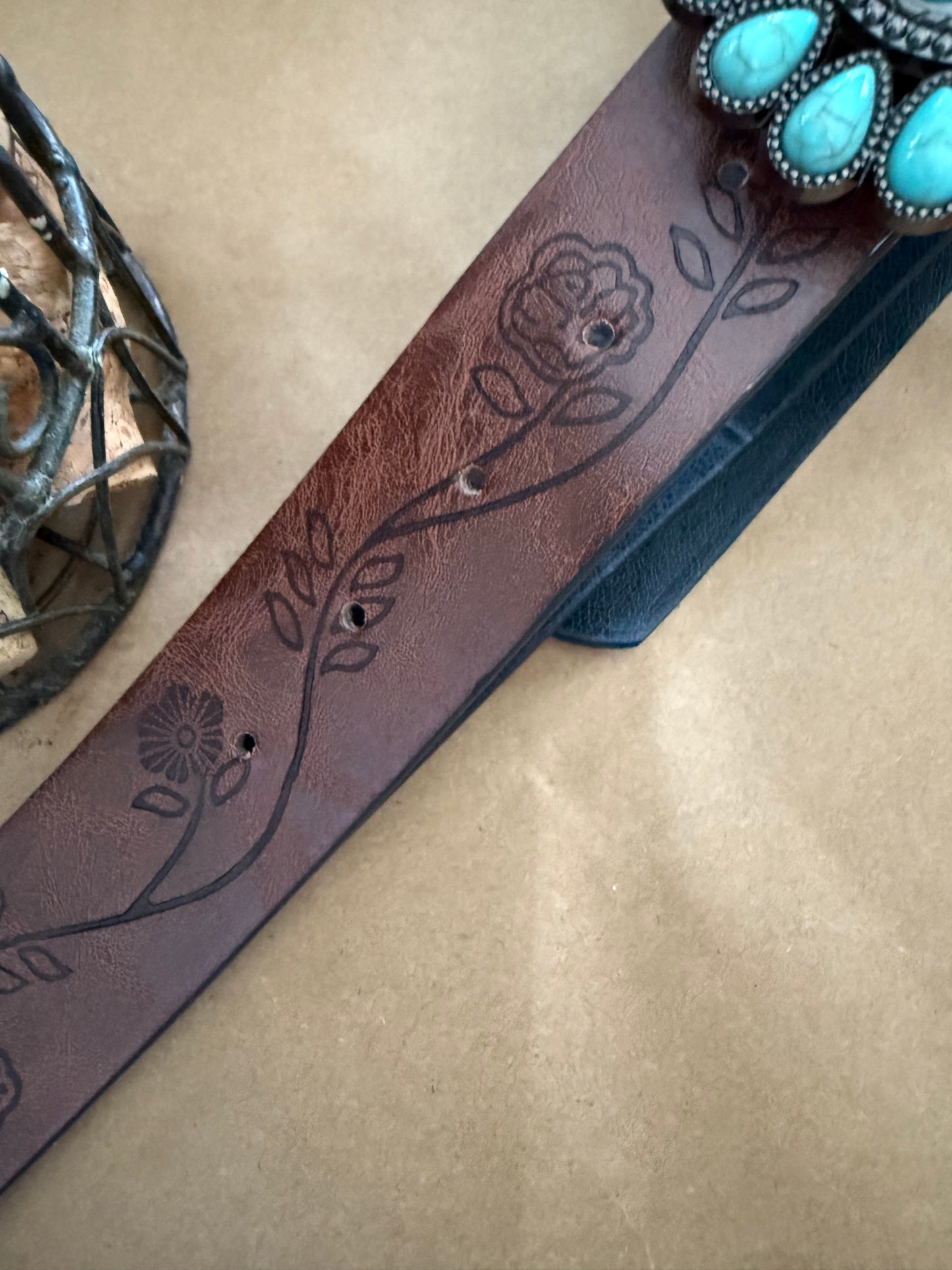 Faux turquoise belt from Ivy's Gifts & Boutique with a decorative buckle, stylish accessory for casual and dressy outfits.