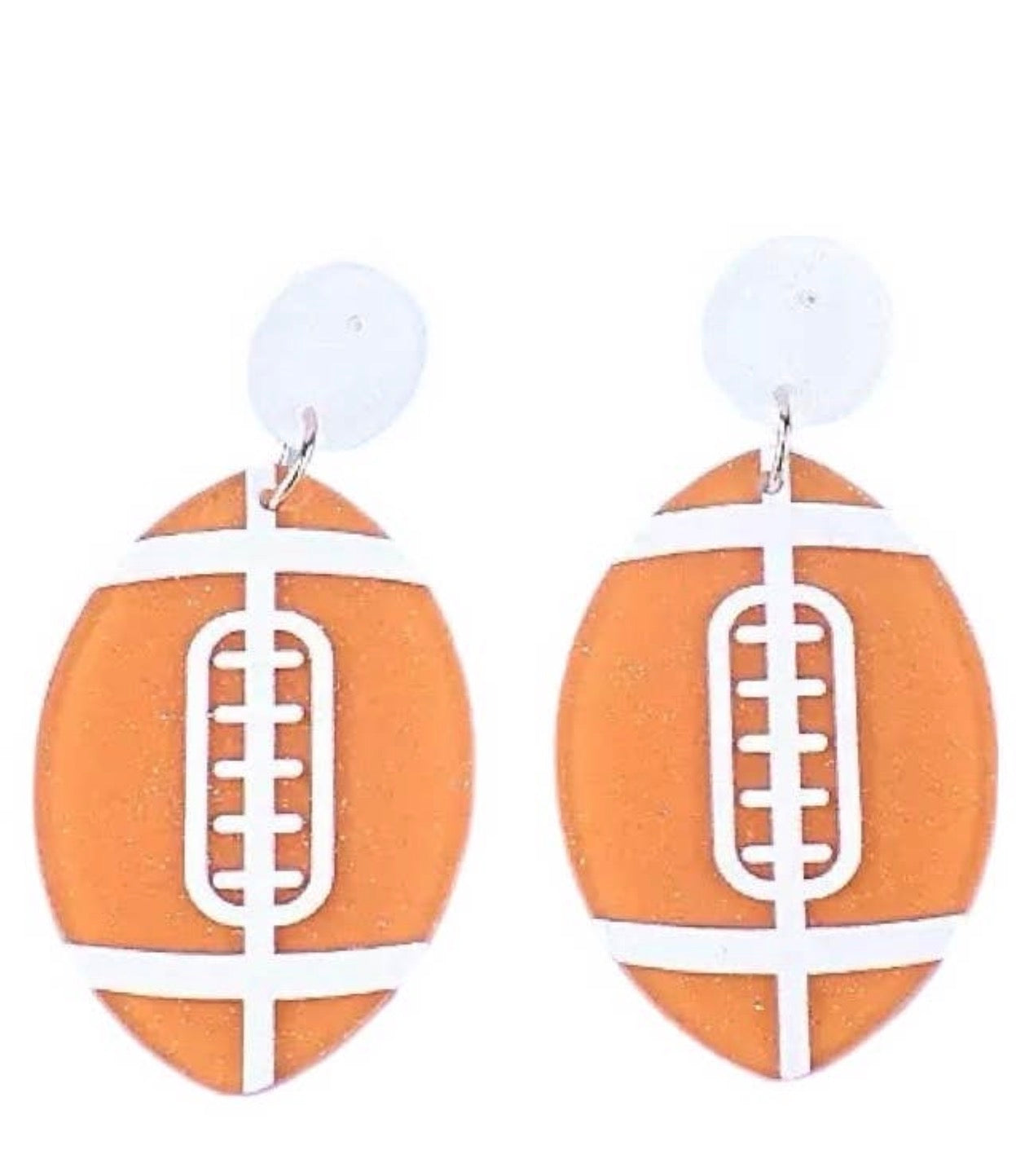 Orange and white acrylic football earrings with silver hooks, featuring a sporty design from Ivy's Gifts & Boutique.