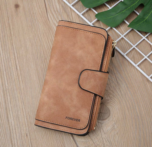 Vegan leather women's wallet with zip coin pouch and multiple card and ID storage pockets, by Ivy's Gifts & Boutique.