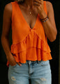 Orange ruffle detail V-neck crop top from Ivy's Gifts & Boutique, featuring a stylish and feminine design with a fitted silhouette.