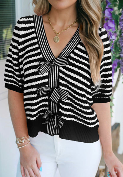 Black and white short sleeve sweater by Ivy's Gifts & Boutique, featuring a stylish design and soft fabric.