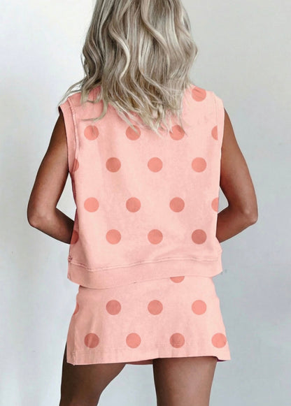 Pink polka dot ribbed trim 2-piece skort set by Ivy's Gifts & Boutique, featuring a matching top and skort with playful pattern.