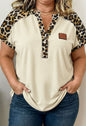 Animal print trimmed short sleeve button neckline top by Ivy's Gifts & Boutique, featuring a stylish animal print design.