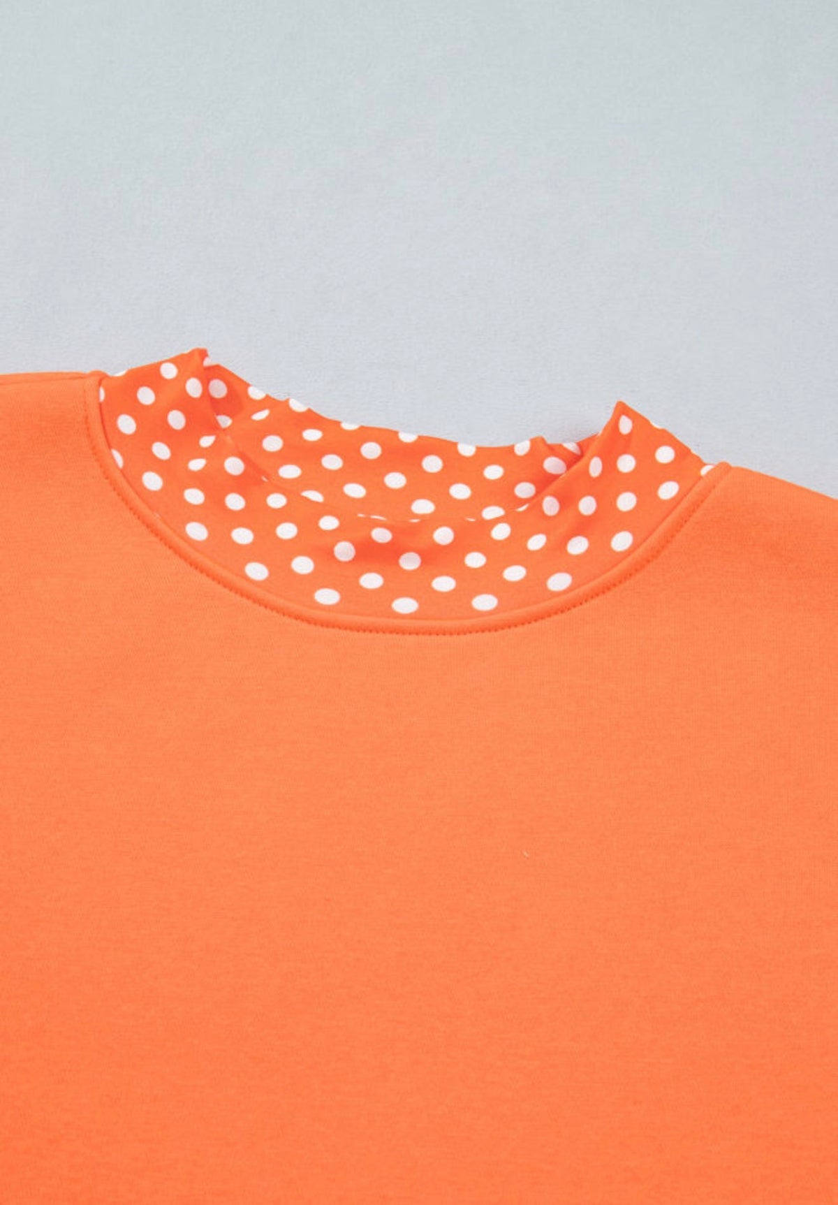 MLOPD Orange Long Sleeve Top with Polka Dot Accented Hem and Sleeve Trim
