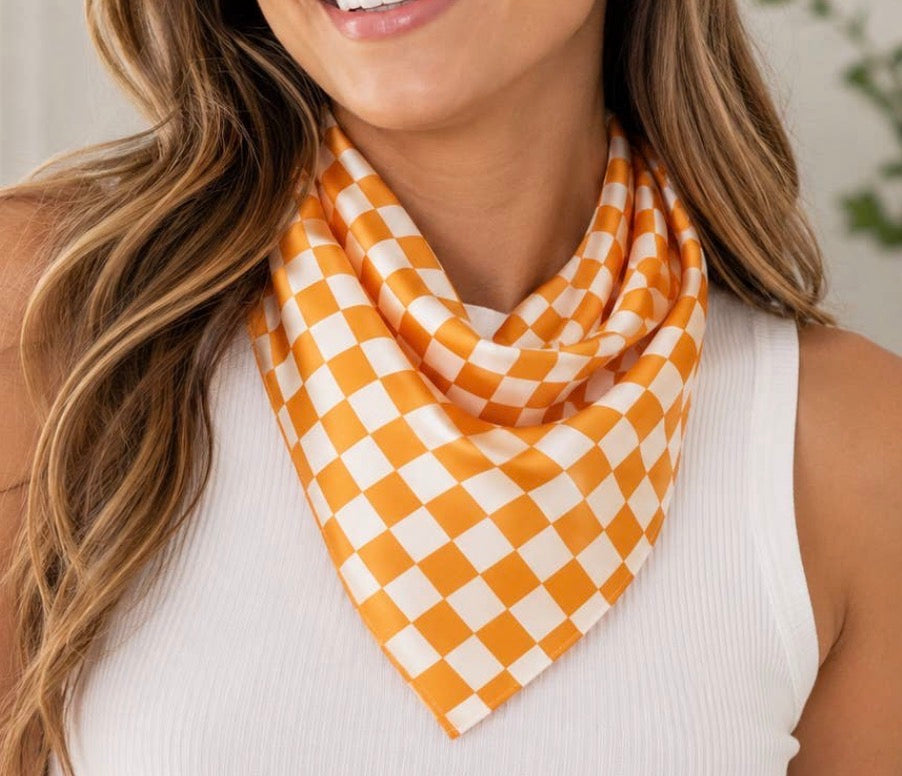 Orange and white checkered Gameday scarf by Ivy's Gifts & Boutique, featuring a stylish checkered pattern.