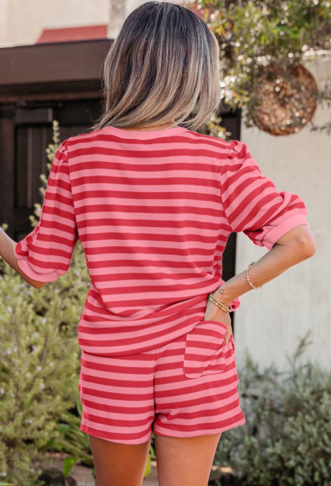 Red and pink striped two-piece short set for girls from Ivy's Gifts & Boutique, featuring a matching top and shorts.