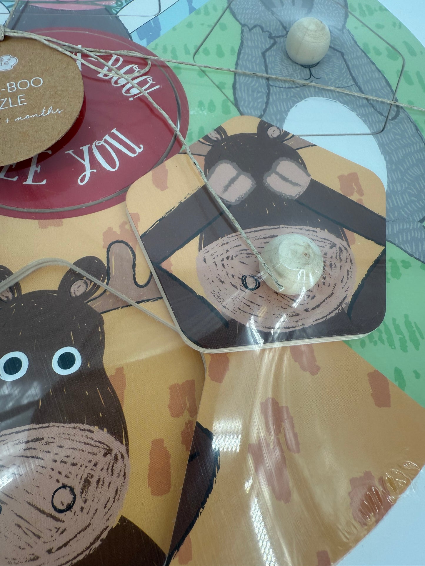 Wooden Puzzle with Peek A Boo theme by Mudpie