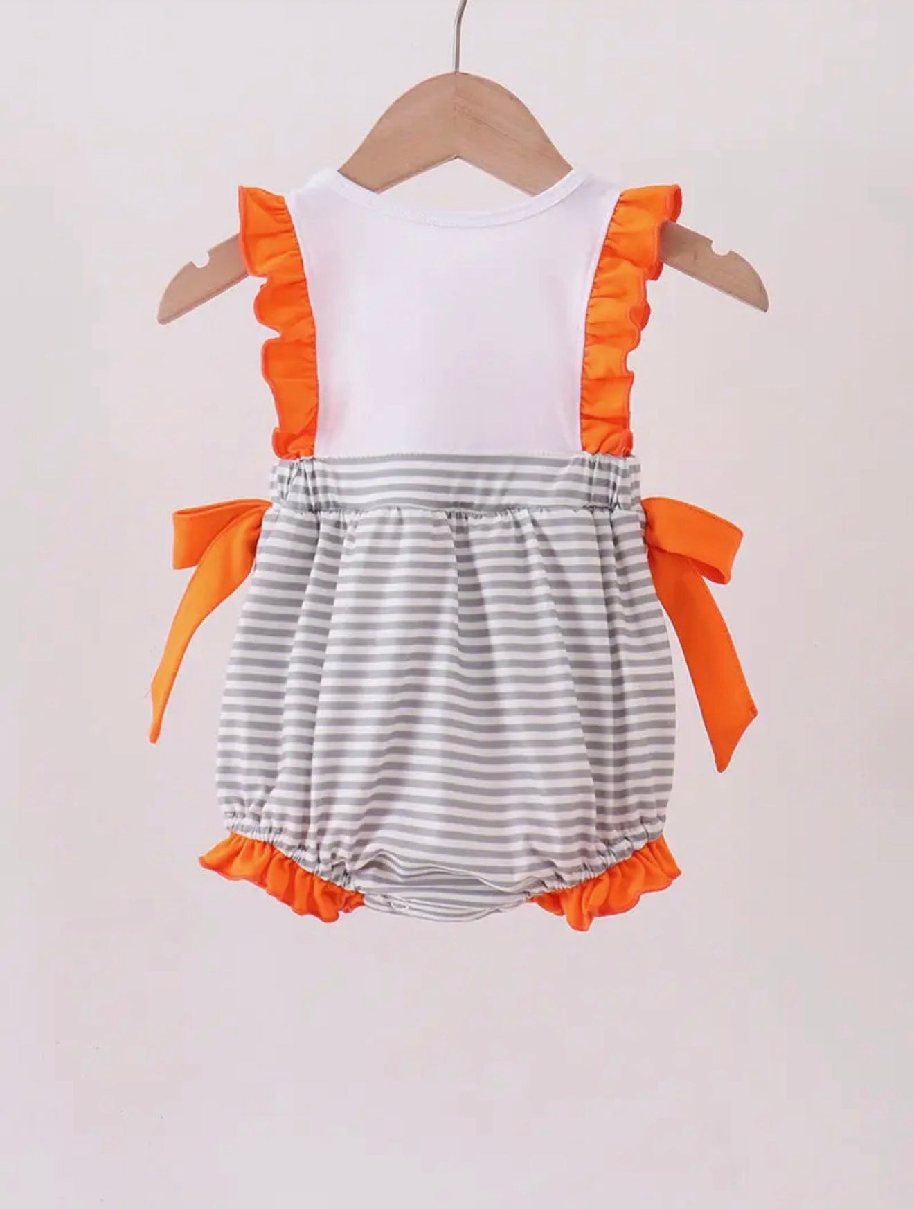 Toddler TN5 orange and white romper bubble with gray stripe embroidery and side bows, from Ivy's Gifts & Boutique.