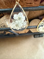 Dried flower earrings by Ivy's Gifts & Boutique featuring delicate floral design and silver hooks.