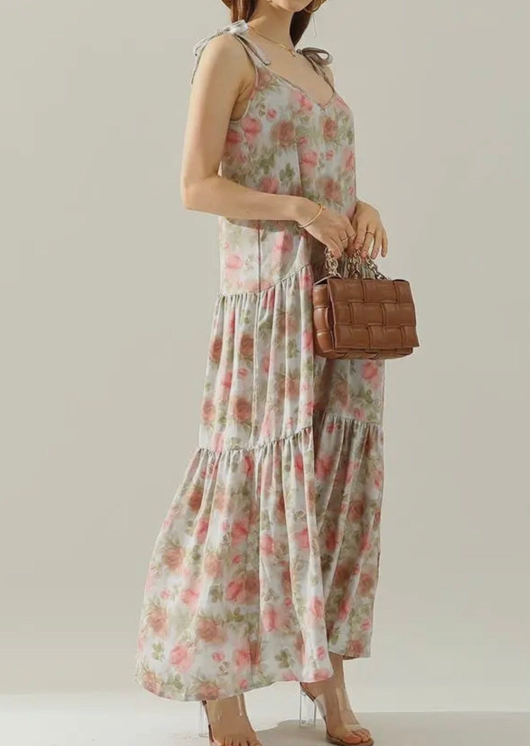 Floral maxi dress with shoulder strap tie detail from Ivy's Gifts & Boutique, featuring a flowy silhouette and vibrant floral pattern.