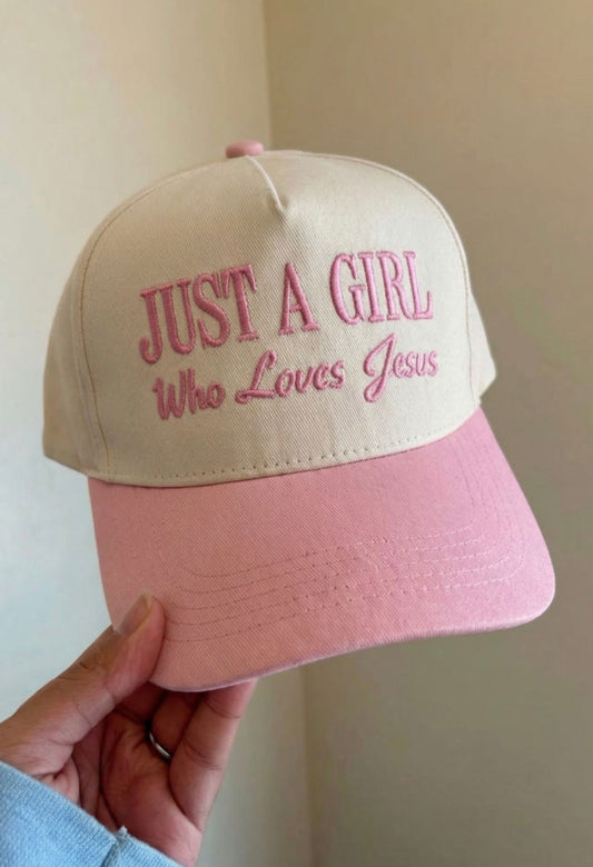 Black baseball cap featuring "Just A Girl" embroidered text, from Ivy's Gifts & Boutique.