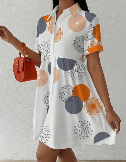 Loose fit print shirt dress from Ivy's Gifts & Boutique, showcasing a fashionable, relaxed style with vibrant patterns.
