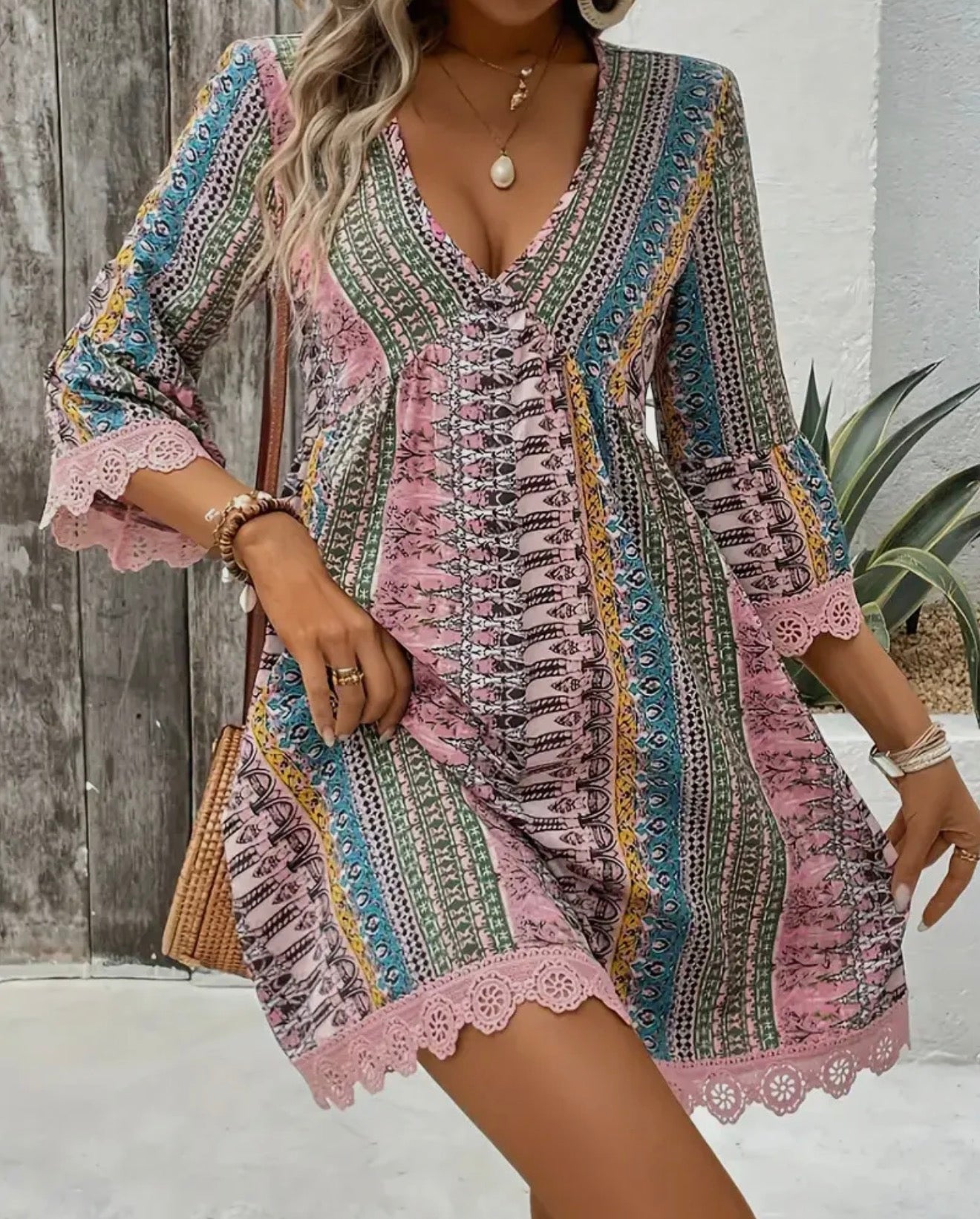 Boho chic V-neck lace trim dress by Ivy's Gifts & Boutique, full-length view showcasing flowing fabric and intricate lace details.