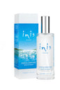 Inis bath and body products set with bottles of lotion and body wash, displayed on a white surface with greenery.