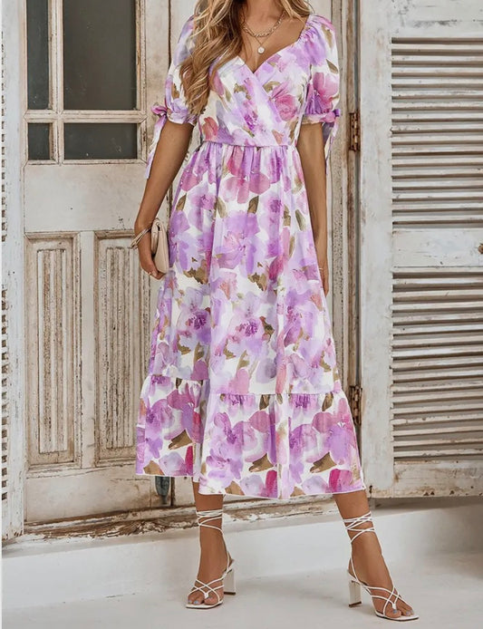 A95 purple pink floral print dress by Ivy's Gifts, featuring a vibrant floral pattern and a feminine silhouette.