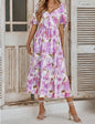 A95 purple pink floral print dress by Ivy's Gifts, featuring a vibrant floral pattern and a feminine silhouette.