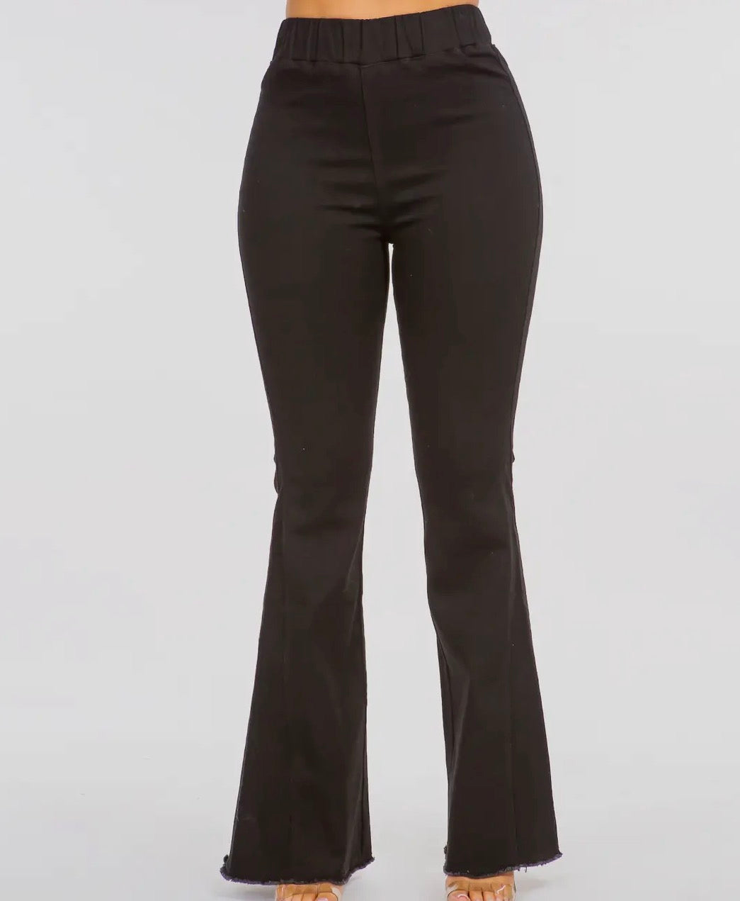 A91 black high waist curvy flare jeans by Ivy's Gifts & Boutique displayed on a model showcasing the fit and style.