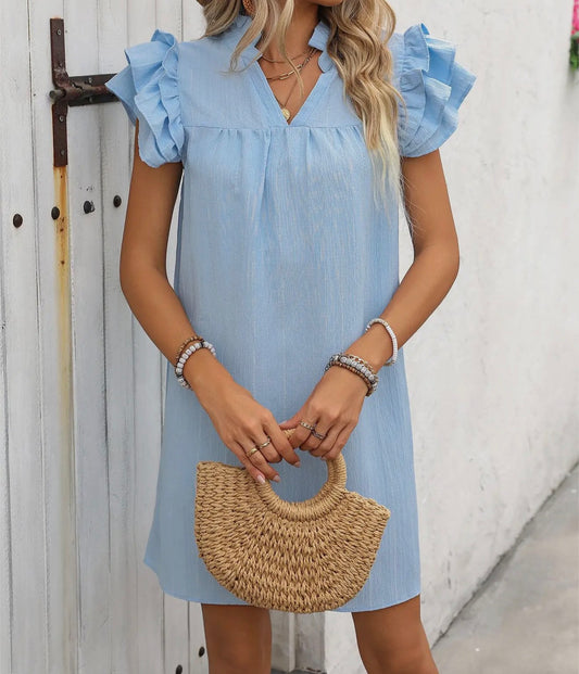 Solid princess ruffle sleeve mini dress by Ivy's Gifts & Boutique, shown in a full view highlighting the ruffled sleeves and fitted silhouette.