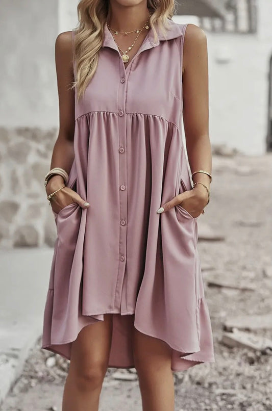 Pink sleeveless dress with collar and button front by Ivy's Gifts & Boutique, displayed on a mannequin against a neutral background.