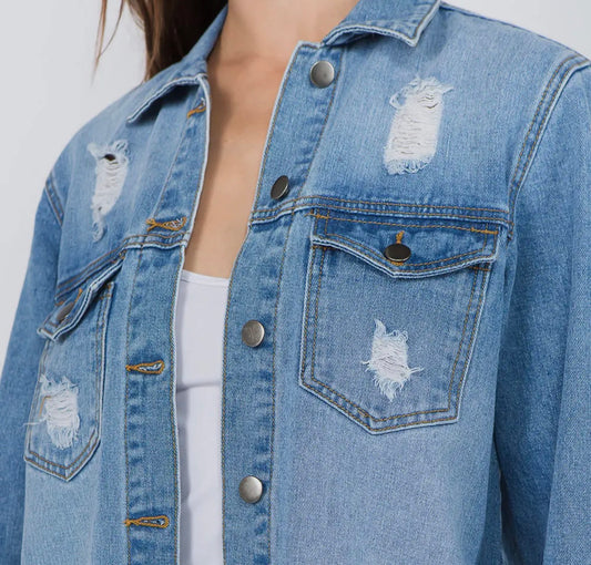 Distressed denim shirt jacket by Ivy's Gifts & Boutique, featuring a relaxed fit and classic button-down design.
