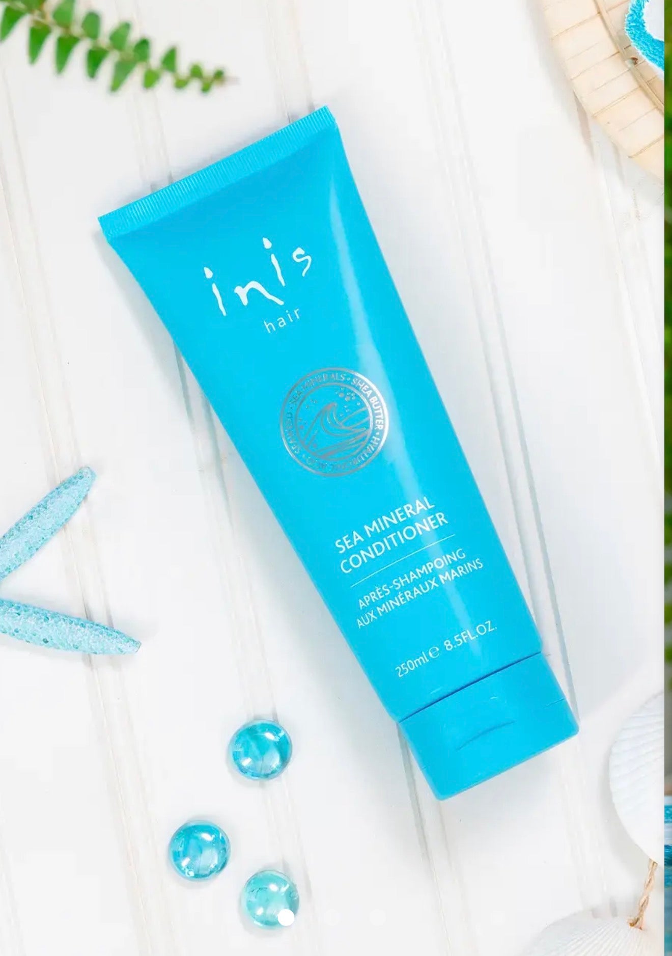 Inis Bath and Body Products set with lotion bottles and skincare items arranged on a white surface