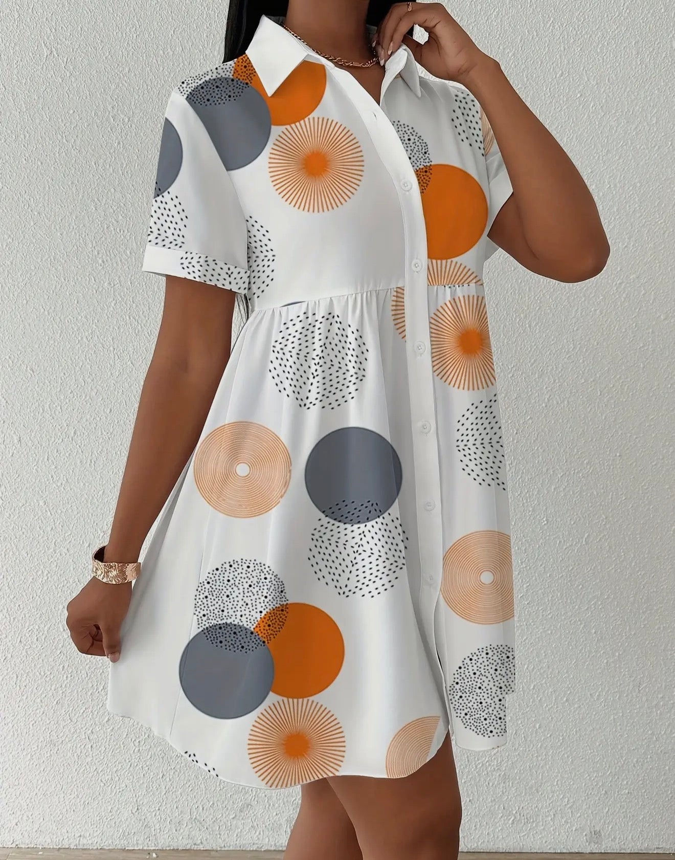 Fashion-forward print loose shirt dress by Ivy's Gifts & Boutique, showcasing a stylish, flowy design with vibrant pattern.