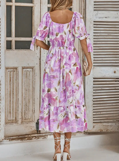 A95 purple pink floral print dress featuring a flowy design and vibrant colors, perfect for spring and summer outings.