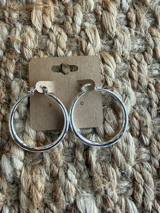 Silver hoop earrings, 1.5 inches in diameter, featuring classic Ivy's Gifts & Boutique jewelry design.
