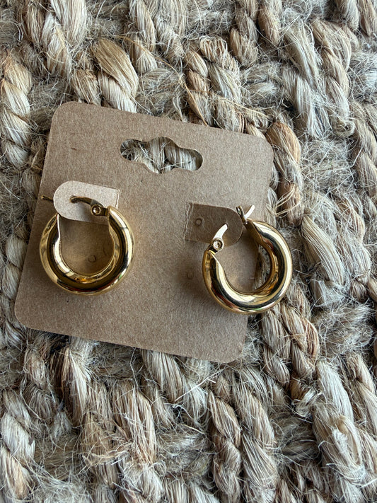 Thick gold hoop earrings measuring 3/4 inch from Ivy's Gifts & Boutique, showcasing their shiny, bold jewelry design.