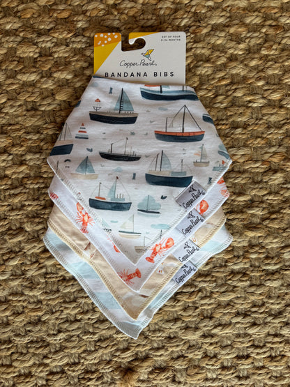 Copper Pearl bandana bibs in soft fabric, featuring stylish patterns and adjustable snaps for babies.